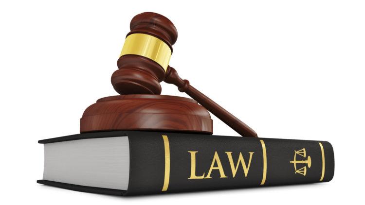 Wooden judge gavel on law book