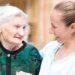 Elderly woman with carer