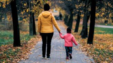 Child holding parents hands