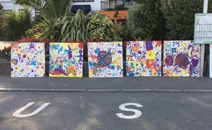 Islanders’ artwork brightens hotel hoarding