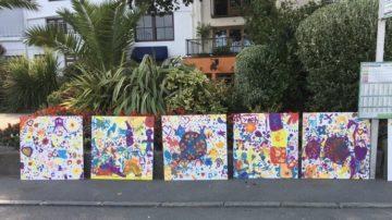 Islanders’ artwork brightens hotel hoarding