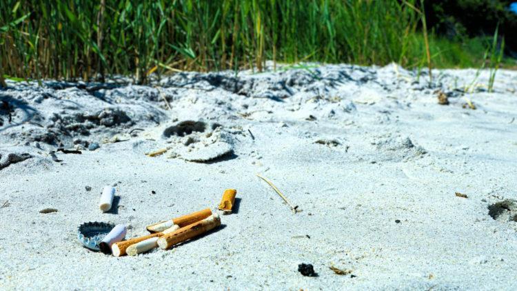 Cigarette smoking on beach