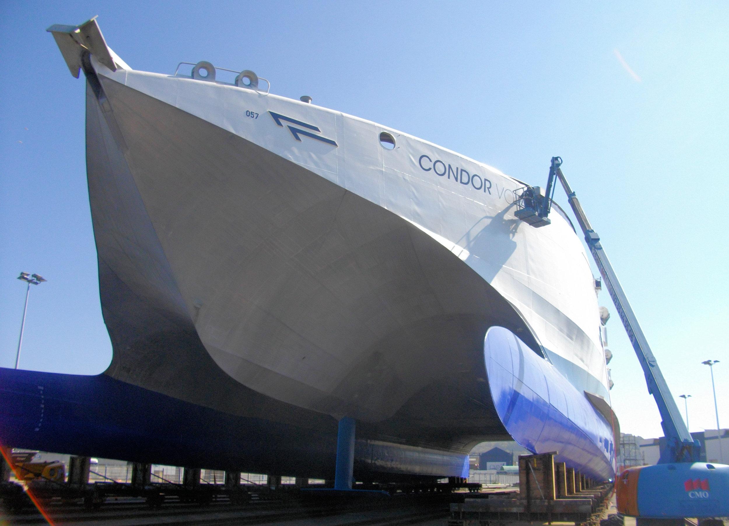 Condor Voyager name being applied to the bow of the high speed catamaran 2021-04-23