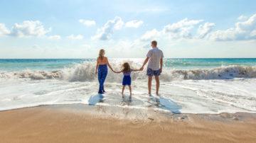 Parents child beach adoption