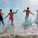 Group beach splash sea