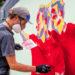 Lions mural - 'Bokra' working on Jersey Reds entrance