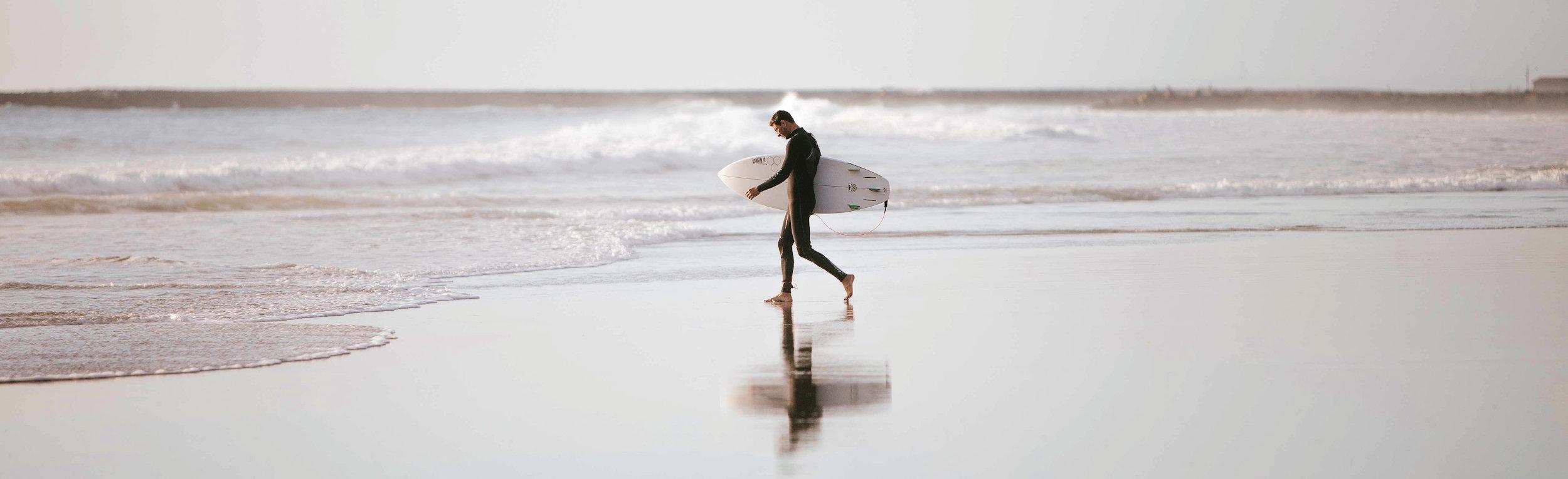 Man beach surfer sea