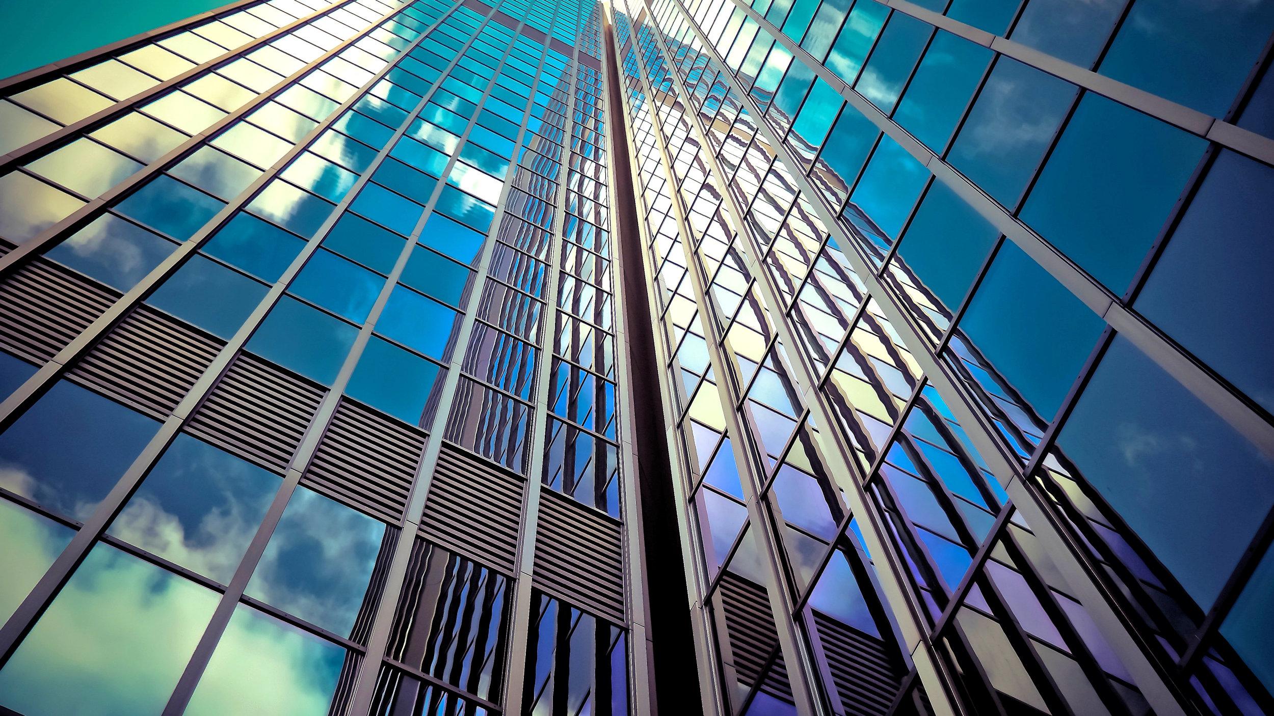 Office building reflections sky clouds