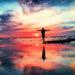 Sea red sky arms outstretched