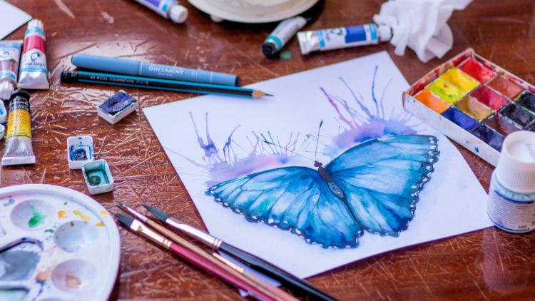 Artist painting butterfly