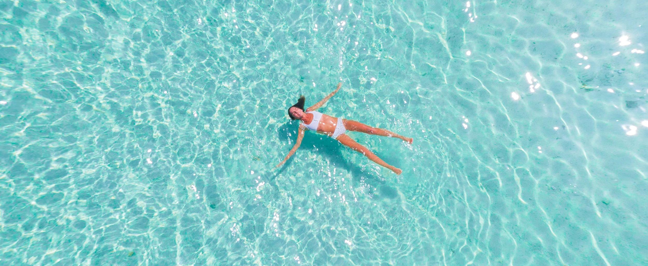 Girl woman floating in pool