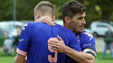 Jersey Bulls Team Captain James Queree embraces team mate