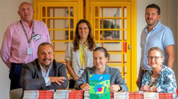 Sure Directory cover comp winner (Back L-R) Trevor Burke, Lindsay Stanford and Mike Fawkner Corbett (Front L-R) Justin Bellinger, Lara Stanford and Cora Lee