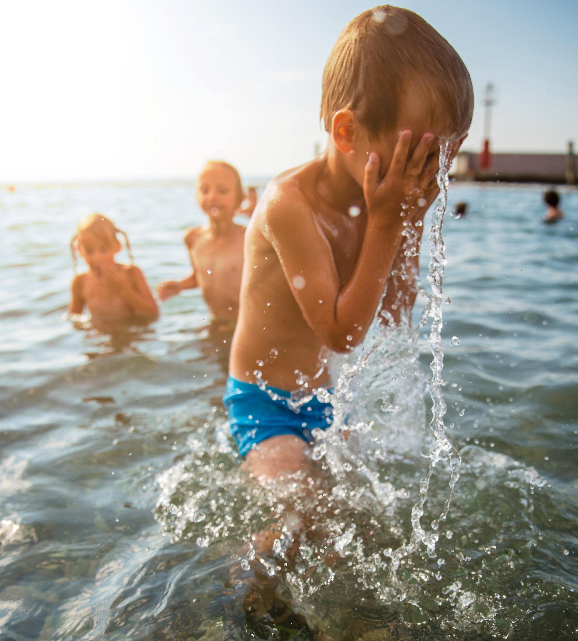 Children splashing in sea
