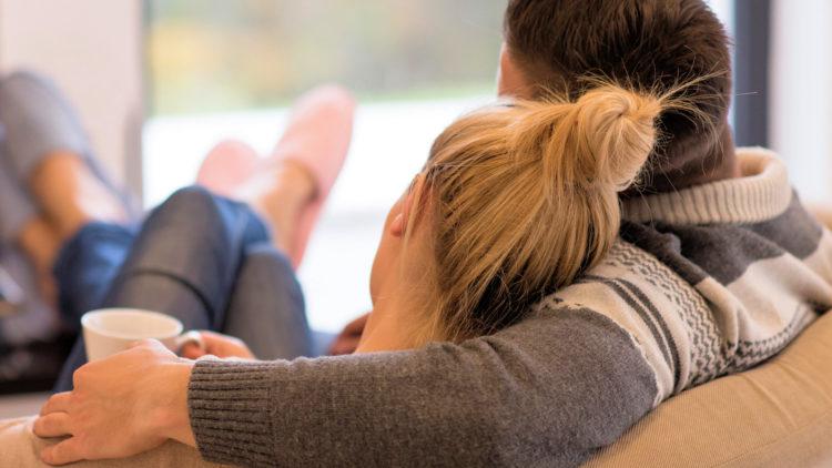 Couple sofa cuddle relaxing