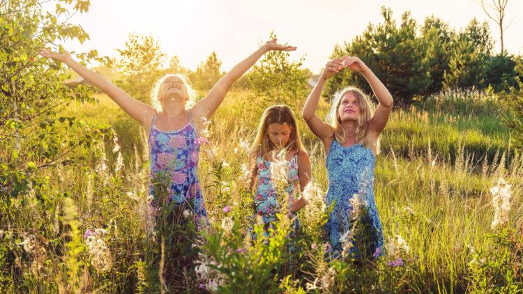 Girls in field flowers
