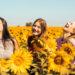 Girls sunflowers field smile happy