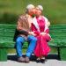 Old couple kissing on bench model