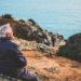 OLd couple looking out to sea