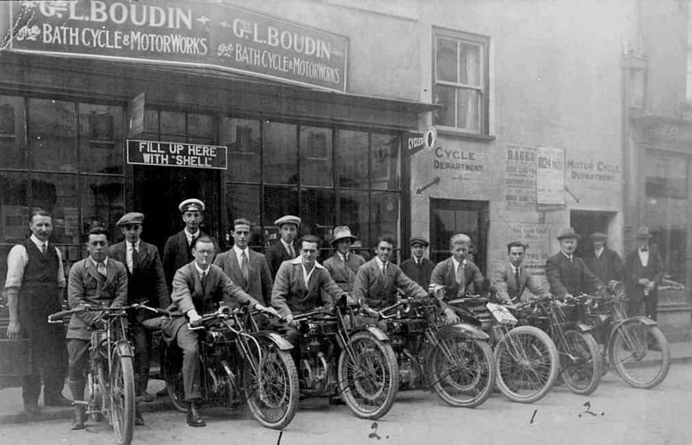 Group of early hill climbers gather outside George Boudin’s Bath Street Shop