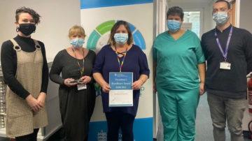 HSC Vice President Deputy Tina Bury presenting the HSC President's Award to the Scheduling and Testing Team 2022-03