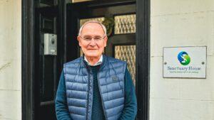 Chair Frank Walker outside Sanctuary House