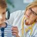 Pediatrician doctor examining child